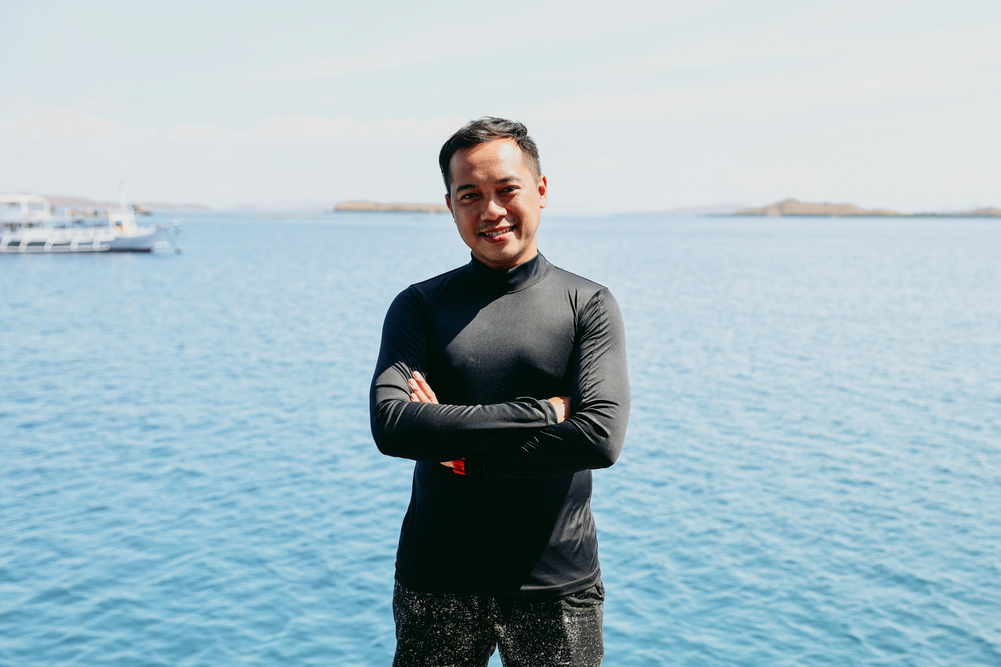 smiling-asian-man-with-sea-view-background Home